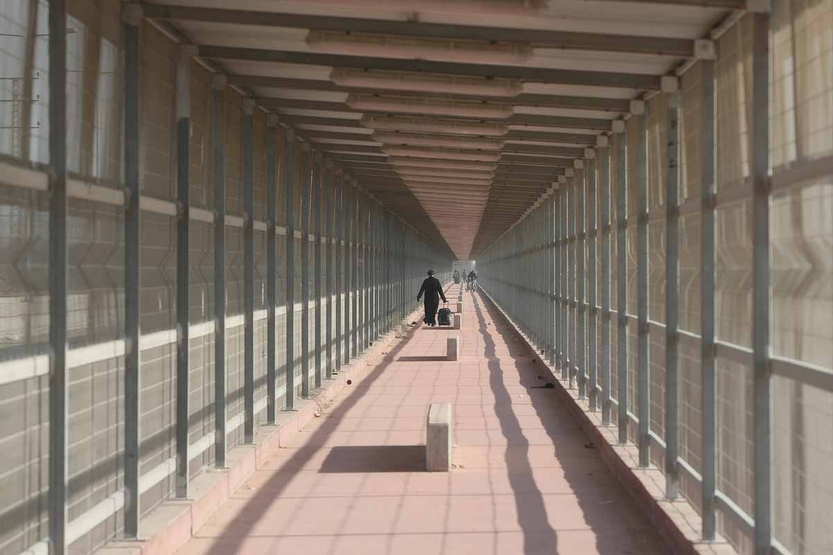 A Palestinian priest from the Gaza Strip walks through the Erez crossing towards Israel, December 22, 2011.