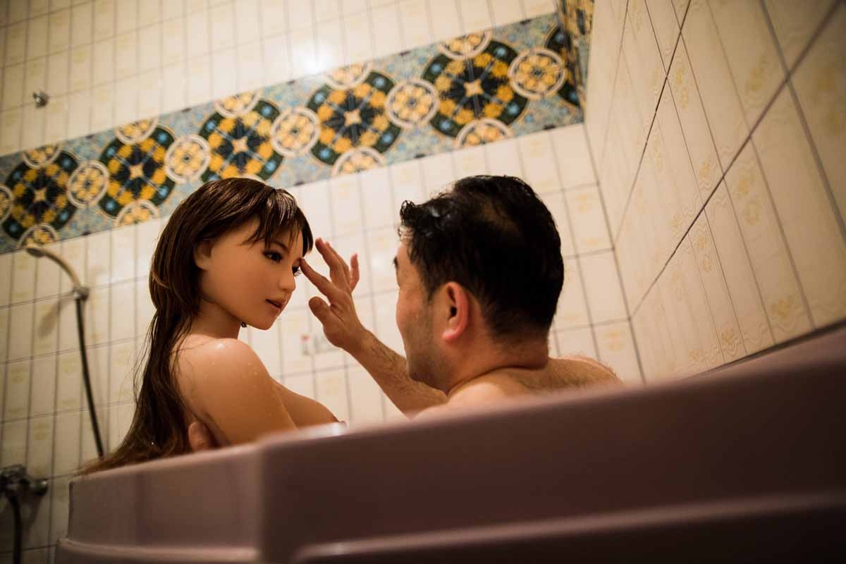 In this picture taken late on June 13, 2017, physiotherapist Masayuki Ozaki takes a bath with his silicone sex doll Mayu at a love hotel in Yachimata, Chiba prefecture.