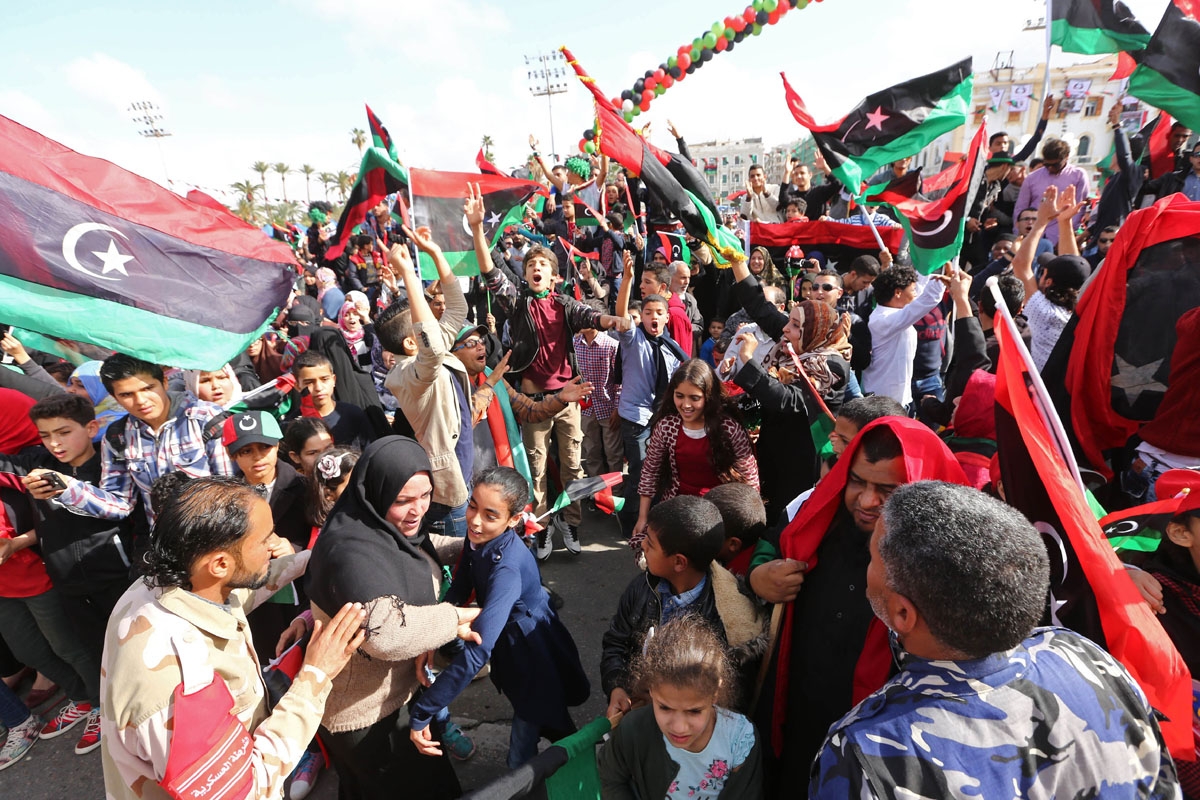 Libyans take part in celebrations marking the fifth anniversary of the Libyan revolution, which toppled strongman Moamer Kadhafi, at Martyrs' Square in the capital Tripoli, on February 17, 2016.
