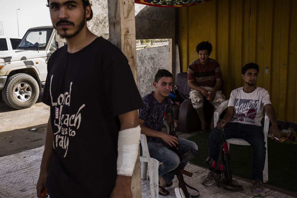 Young fighters rest at a check point in Sirte, Libya, on September 21, 2016.
