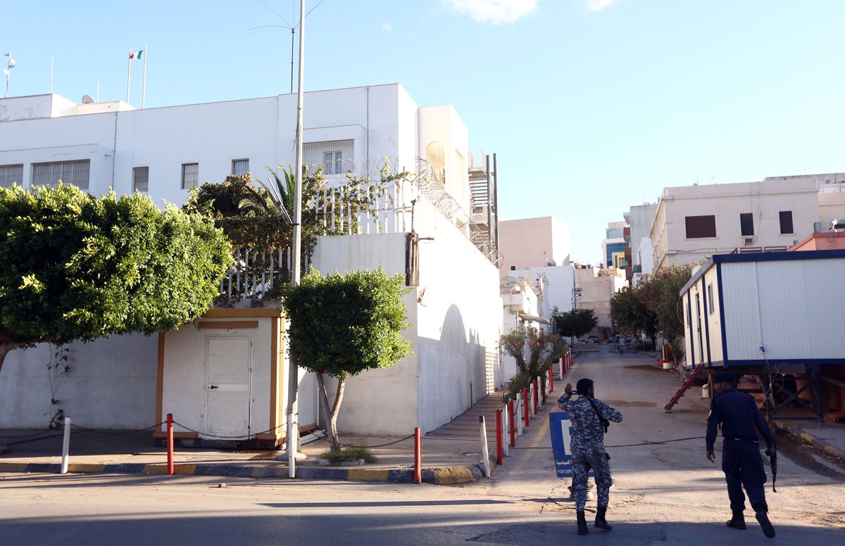 Libyan security forces stand guard outside the Italian embassy in the capital Tripoli on November 9, 2016 following a plan to re-open embassies and diplomatic missions in the country.
