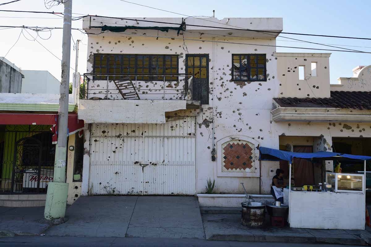 View of a house with hundreds of bullet holes in Cualican, Sinaloa state, Mexico, on December 7, 2016.