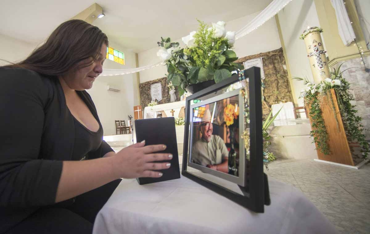 A relative of Mexican journalist Javier Valdez holds the urn with his ashes during the second day of his funeral in Culiacan, Sinaloa State, Mexico on May 17, 2017.