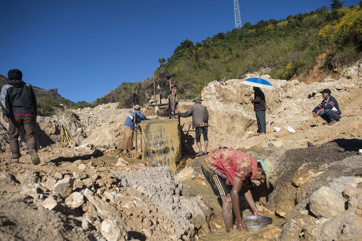This photo taken on November 25, 2016 shows miners working in a ruby mine in Mogok, north of Mandalay.
