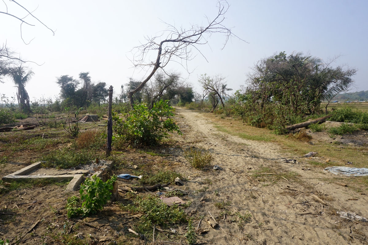 In this photograph taken on March 18, 2018 during a Myanmar government arranged press tour, charred debris of houses and vegetation are seen in the abandoned village of minority Rohingya Muslims in Inn Din located in Maungdaw, in Rakhine state near the Ba