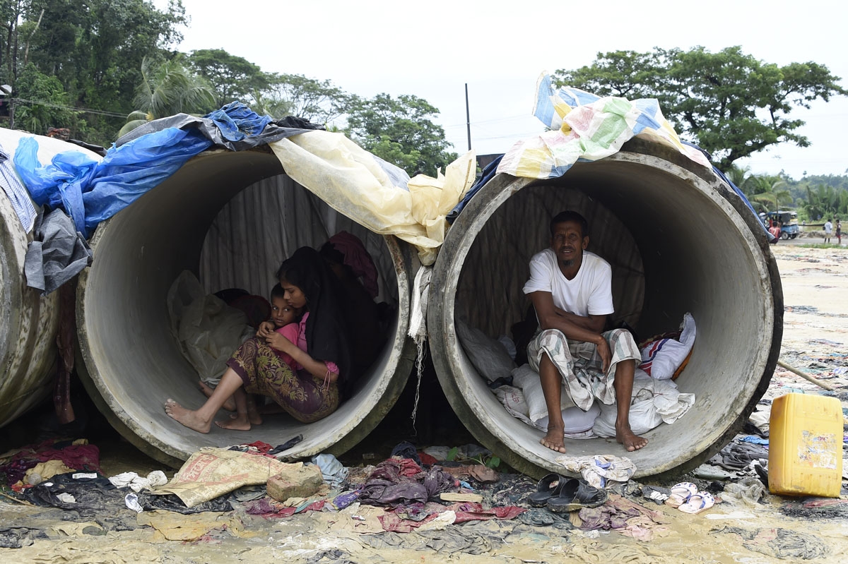 Rohingya Muslim refugees shelter in cement pipes at Kutupalong refugee camp in the Bangladeshi district of Ukhia on September 20, 2017.