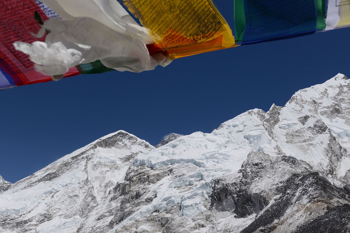 Mount Everest is seen beneath some prayer flags, April, 2018.