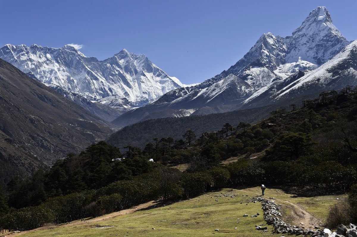 A Nepalese porter carries a load in the Kumbh region of northeastern Nepal, April, 2015.