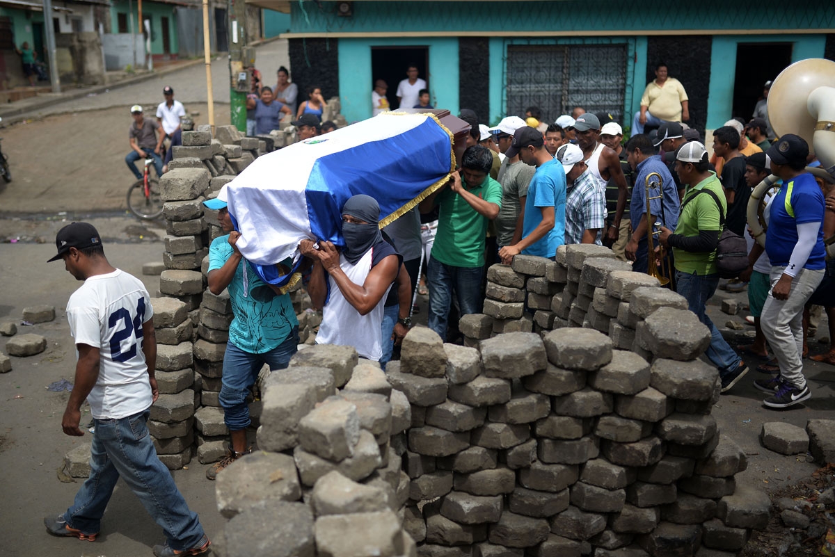 Friends and relatives carry the coffin of Jose Esteban Sevilla Medina, who was shot dead during clashes with riot police and paramilitaries at Monimbo neighbourhood in Masaya, some 35 km from Managua, on July 16, 2018