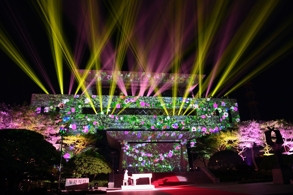 An image of flowers is beamed onto the Peace House where the summit between North Korea's leader Kim Jong Un and South Korea's President Moon Jae-in had taken place, during a closing ceremony at the end of their historic summit at the truce village of Pan