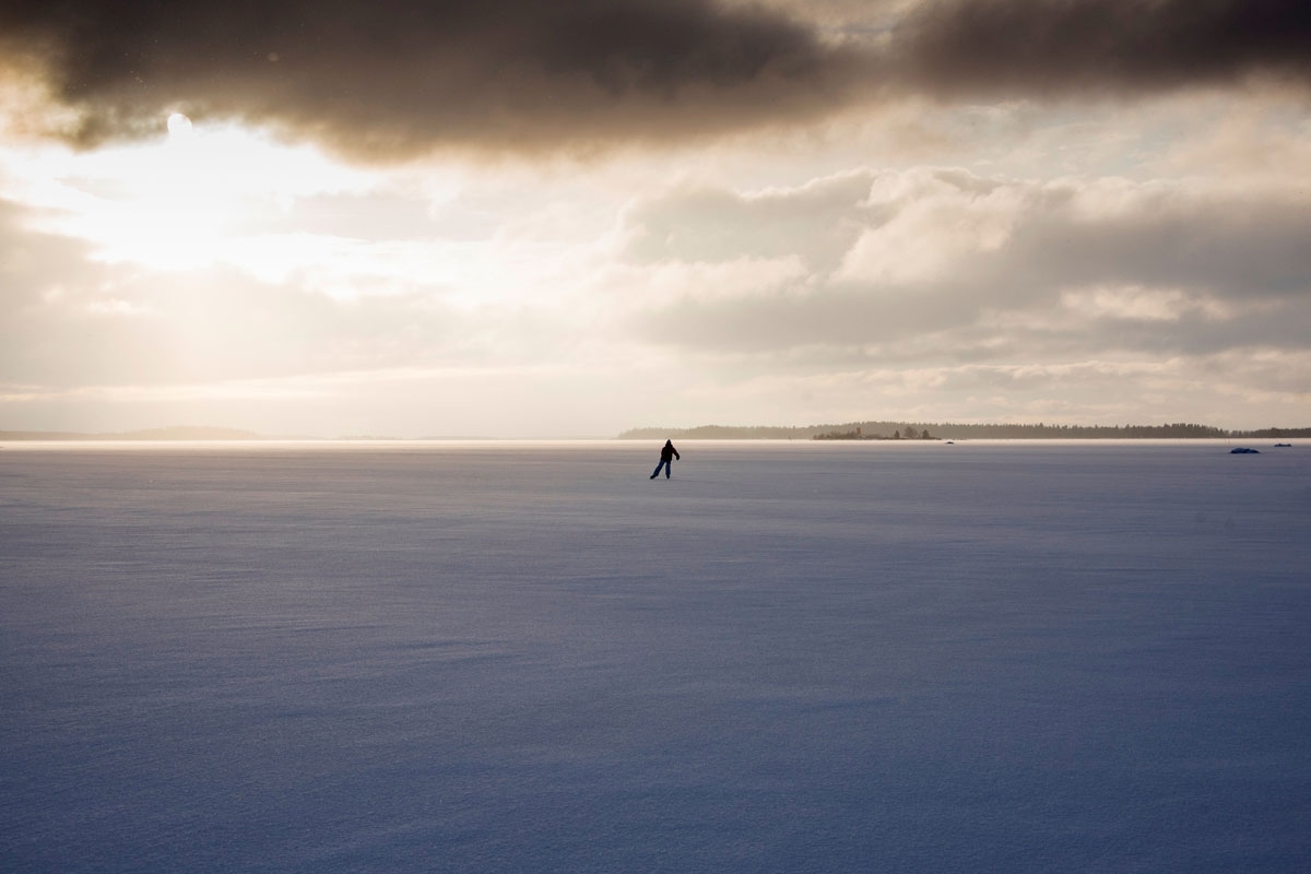 A woman skates on the frozen Bothnia sea (Baltic Sea), on January 30, 2018, in Vaasa, northern Norway, Lofoten islands, within the Arctic Circle. /
