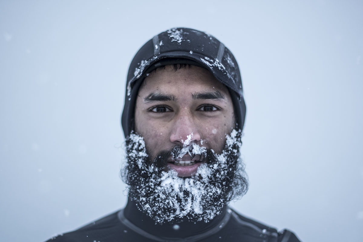 Leela Krischna from India poses after a surf session, on March 11, 2018 in Unstad northern Norway, Lofoten islands, within the Arctic Circle as air temperature drops minus 13°C and water temperature above 4°C.