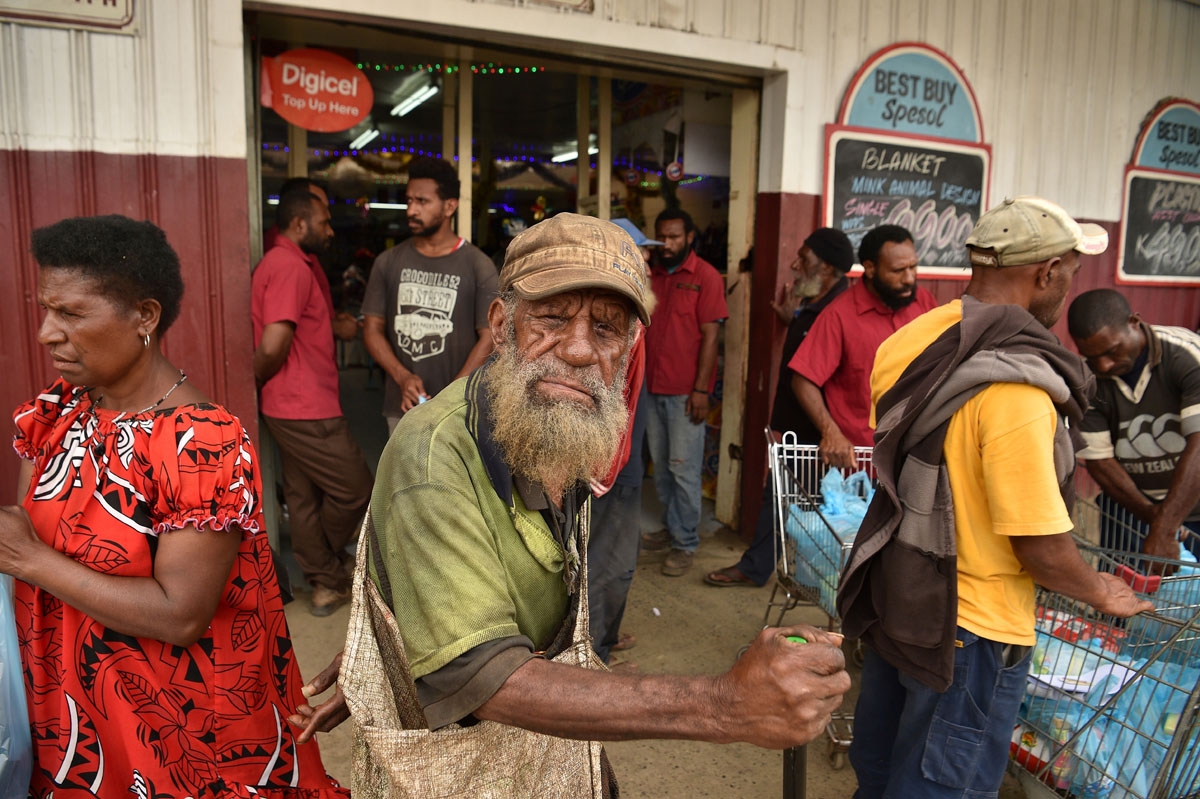 Locals are seen on a street in Mount Hagen in the highlands on November 19, 2018, one day after the Asia-Pacific Economic Cooperation (APEC) Summit in Port Moresby.