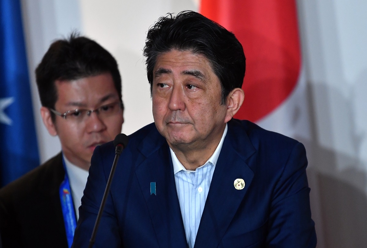 Japan's Prime Minister Shinzo Abe attends an electricity projects signing ceremony during the Asia-Pacific Economic Cooperation (APEC) Summit in Port Moresby on November 18, 2018.