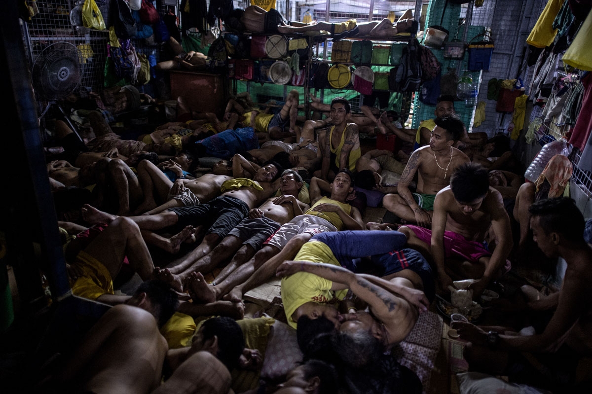 Inmates rest in their sleeping quarters inside the Quezon City jail at night in Manila in this picture taken on July 18, 2016.