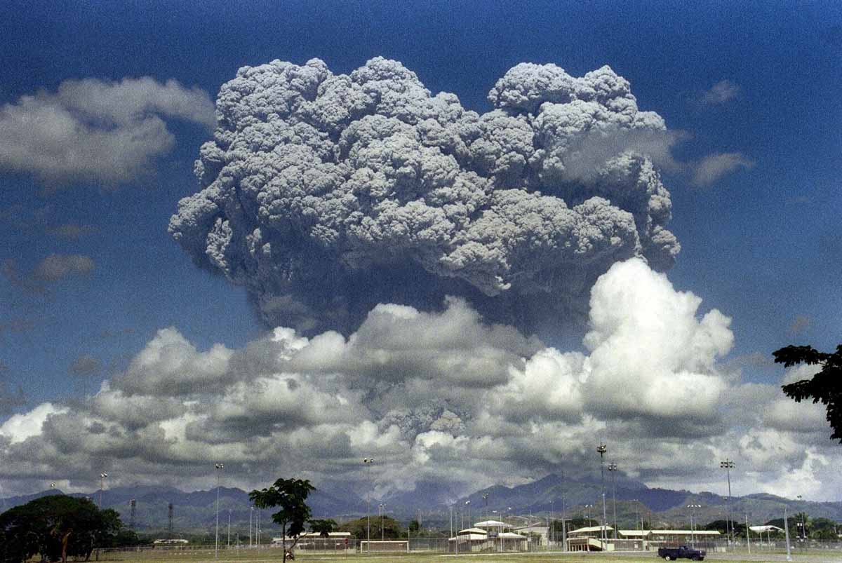 This picture taken 12 June 1991 shows a giant mushroom cloud of steam and ash exploding out of Mount Pinatubo volcano during its eruption as seen from inside the then US military Clark Air Base in Angeles, located in Pampanga province. 