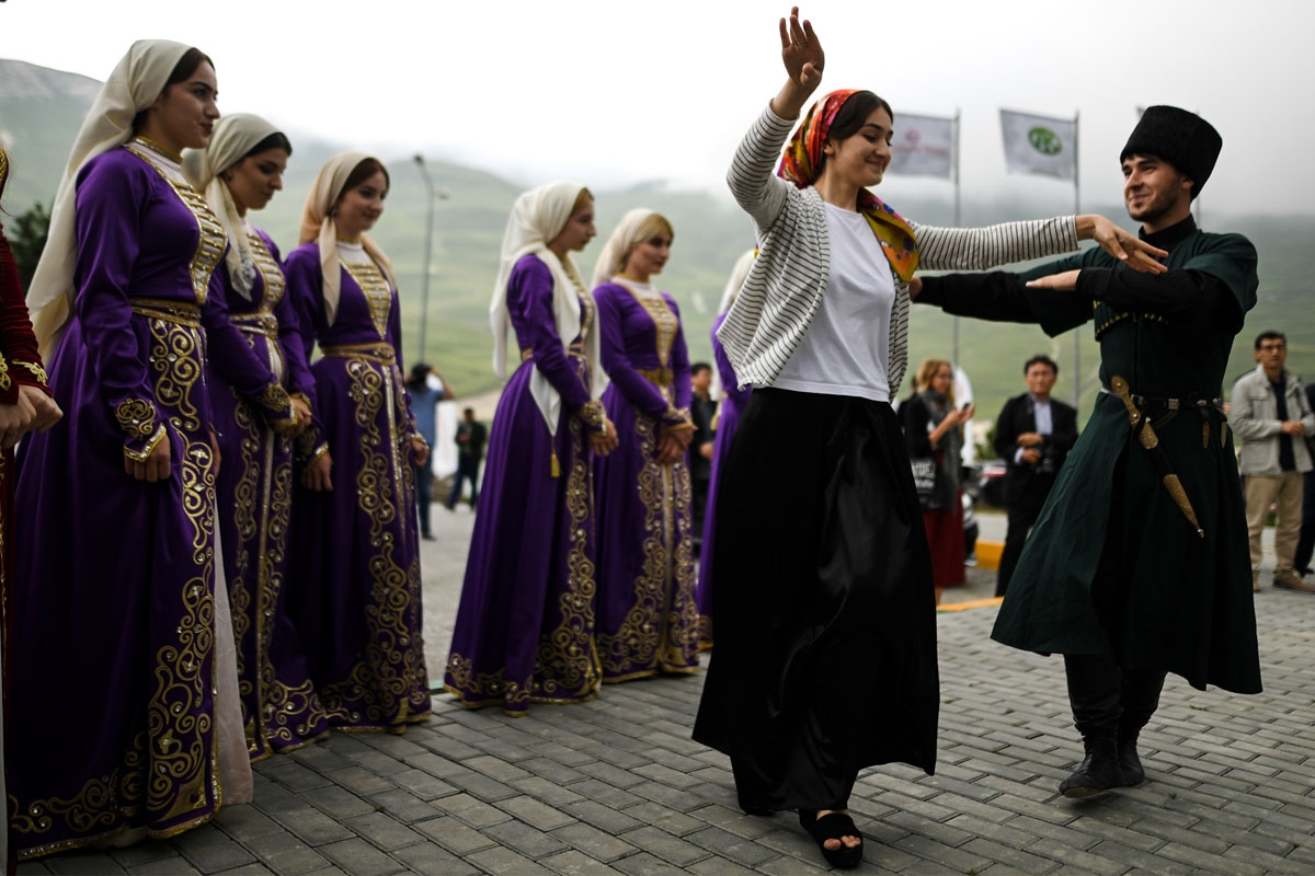 Chechens perform a traditional dance in the village of Kezenoyam, about 80 km from Grozny on July 25, 2017