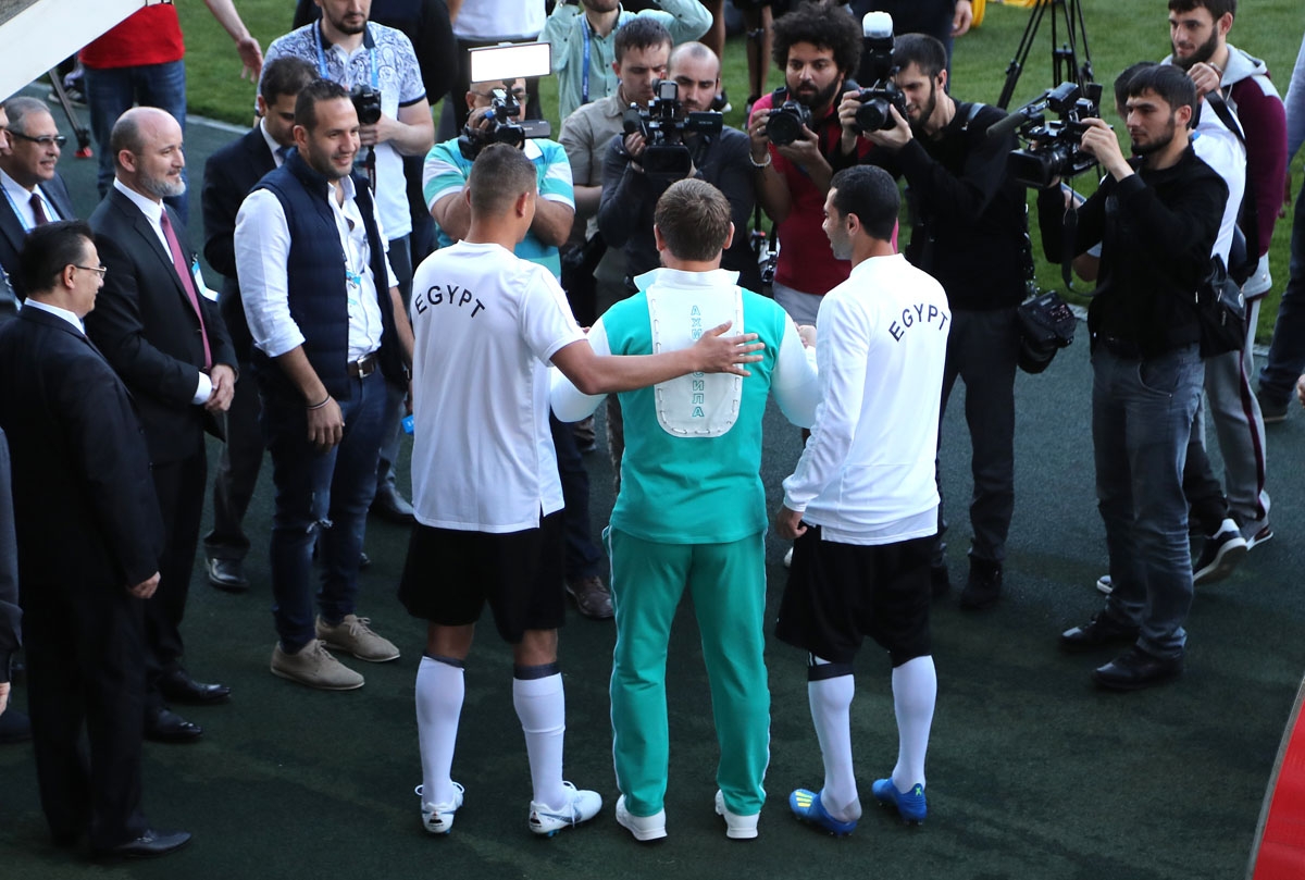 Head of the Chechen Republic Ramzan Kadyrov (C) poses with Egyptian national football Ahmed Fathi (R) and Samir Saad (L) prior to a training of Egyptian team at the Akhmat Arena stadium in Grozny on June 10, 2018, ahead of the Russia 2018 World Cup.