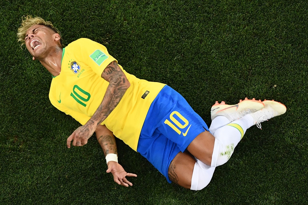 Brazil's forward Neymar reacts after beeing tackled by Switzerland's midfielder Valon Behrami during the Russia 2018 World Cup Group E football match between Brazil and Switzerland at the Rostov Arena in Rostov-On-Don on June 17, 2018.