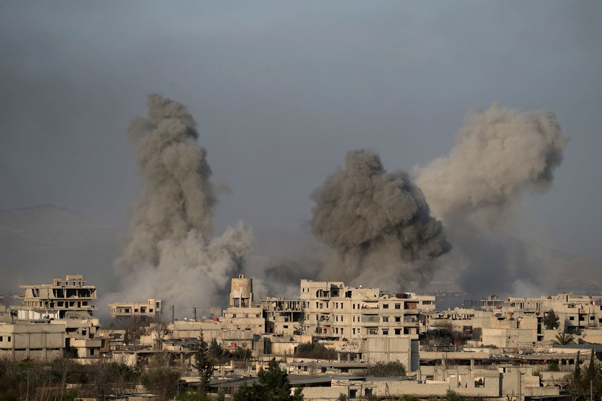 Smoke billows following Syrian government bombardments on the besieged rebel-held town of Hamouria in the eastern Ghouta region on the outskirts of the capital Damascus on March 3, 2018.