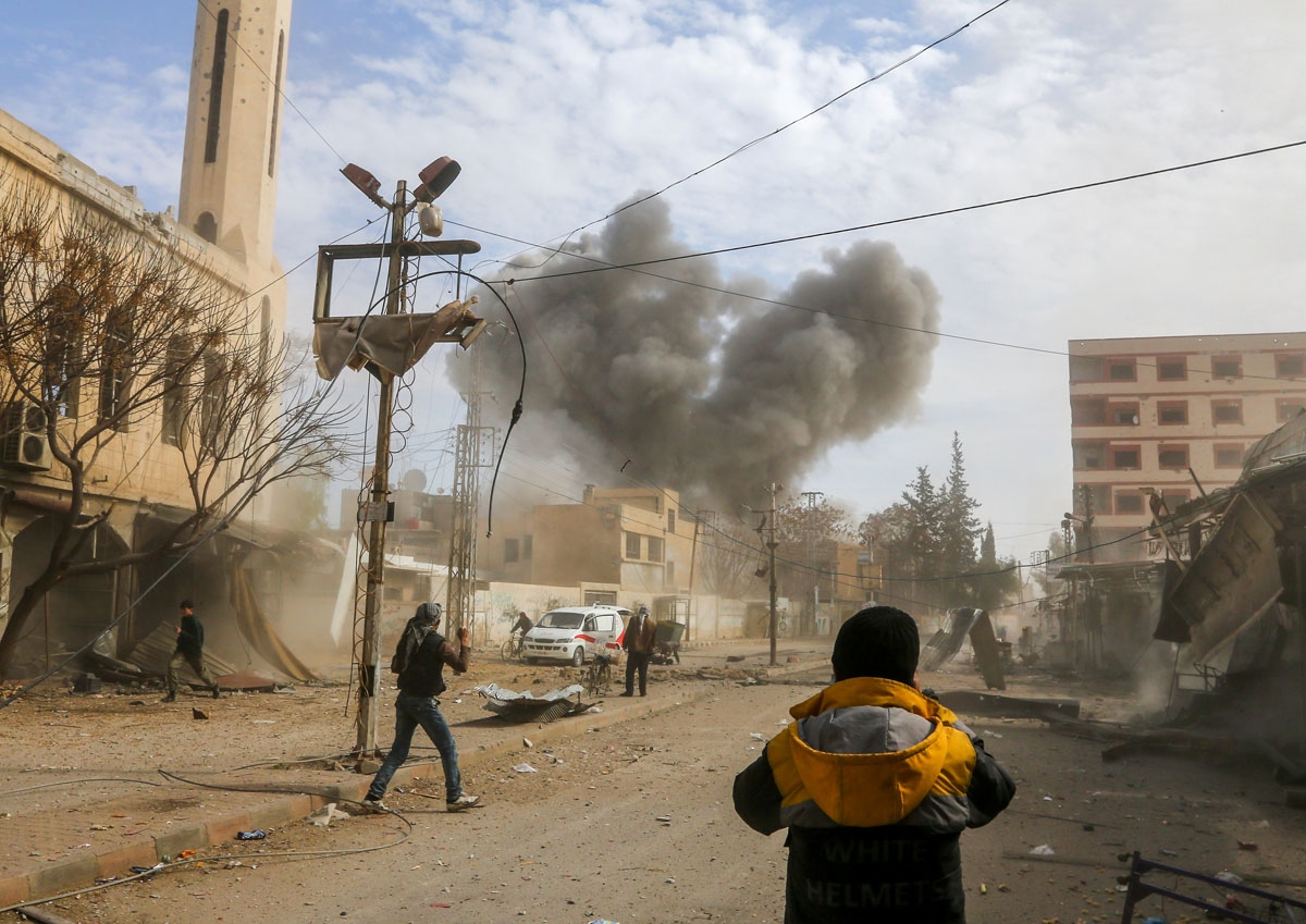 A picture taken on February 8, 2018 shows smoke plumes rising following a reported regime air strike in the rebel-held enclave of Jisreen in the Eastern Ghouta near Damascus.