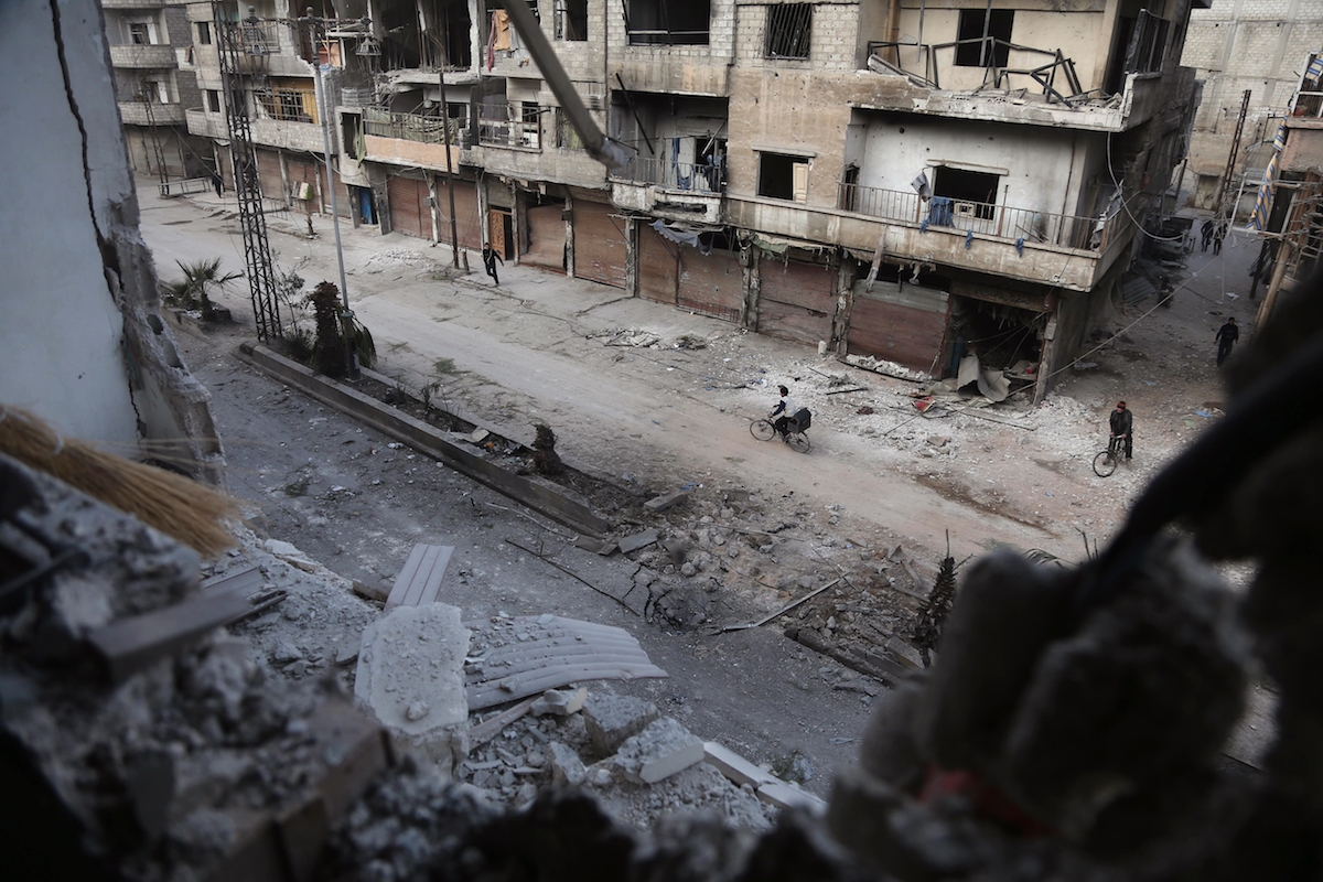 A picture shows the scene following a reported regime air strike in the rebel-held town of Hamouria, in the besieged Eastern Ghouta region on the outskirts of the capital Damascus on February 21, 2018.