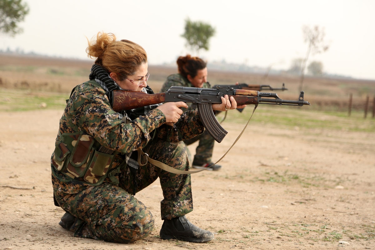 Syriac Christian women, members of the battalion called the Female Protection Forces of the Land Between the Two Rivers fighting the Islamic State group, take part in a training on December 1, 2015 at their camp in the town of al-Qahtaniyah, near the Syri