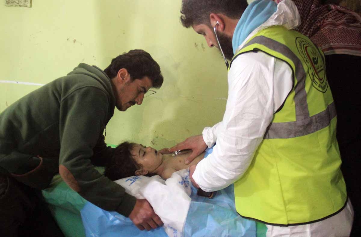 An unconscious Syrian child receives treatment at a hospital in Khan Sheikhun, a rebel-held town in the northwestern Syrian Idlib province, following a suspected toxic gas attack on April 4, 2017.