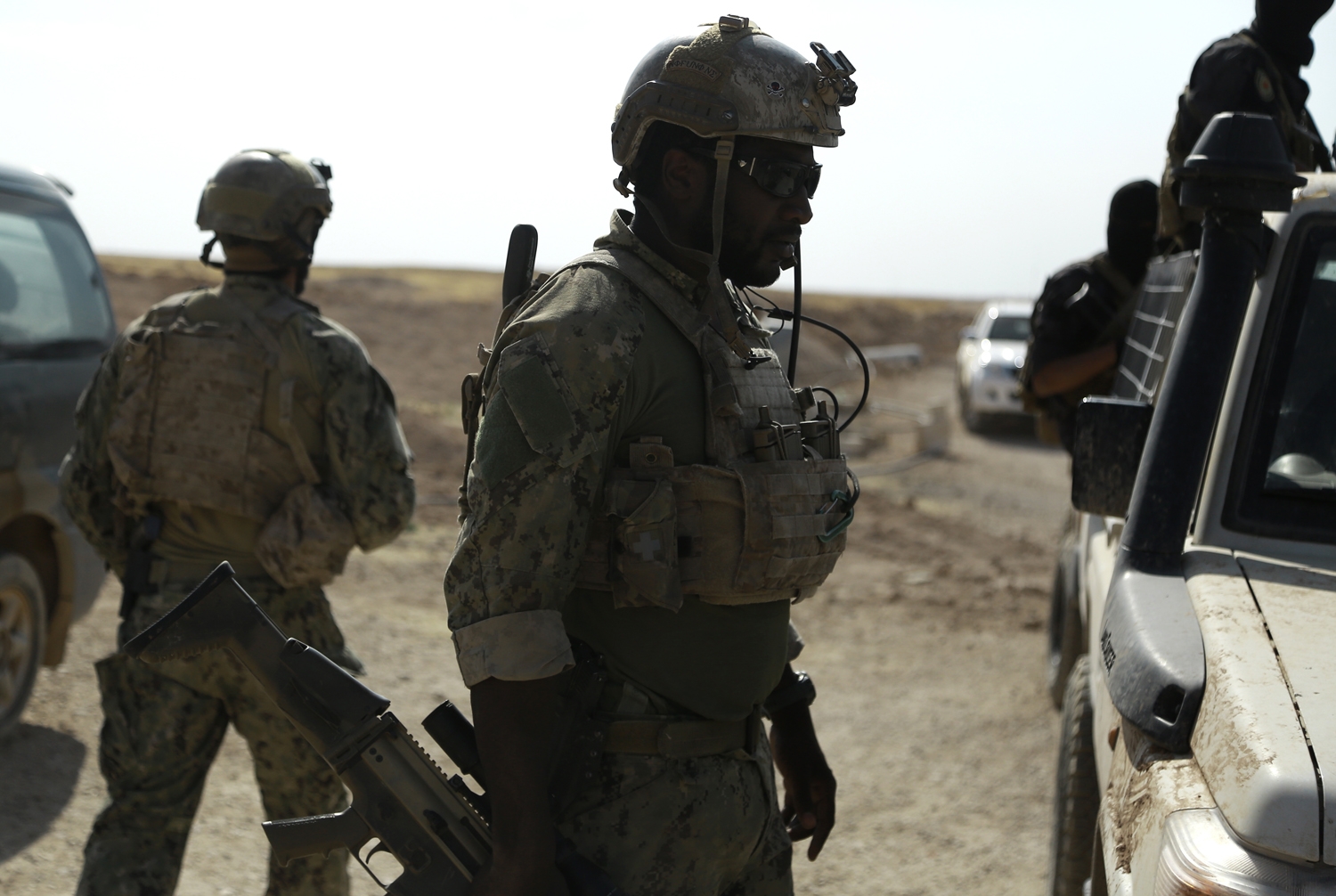 Armed men in uniform identified by Syrian Democratic forces as US special operations forces are seen in the village of Fatisah in the northern Syrian province of Raqa on May 25, 2016 Armed men in uniform identified by Syrian Democratic forces as US special operations forces are seen in the village of Fatisah in the northern Syrian province of Raqa on May 25, 2016