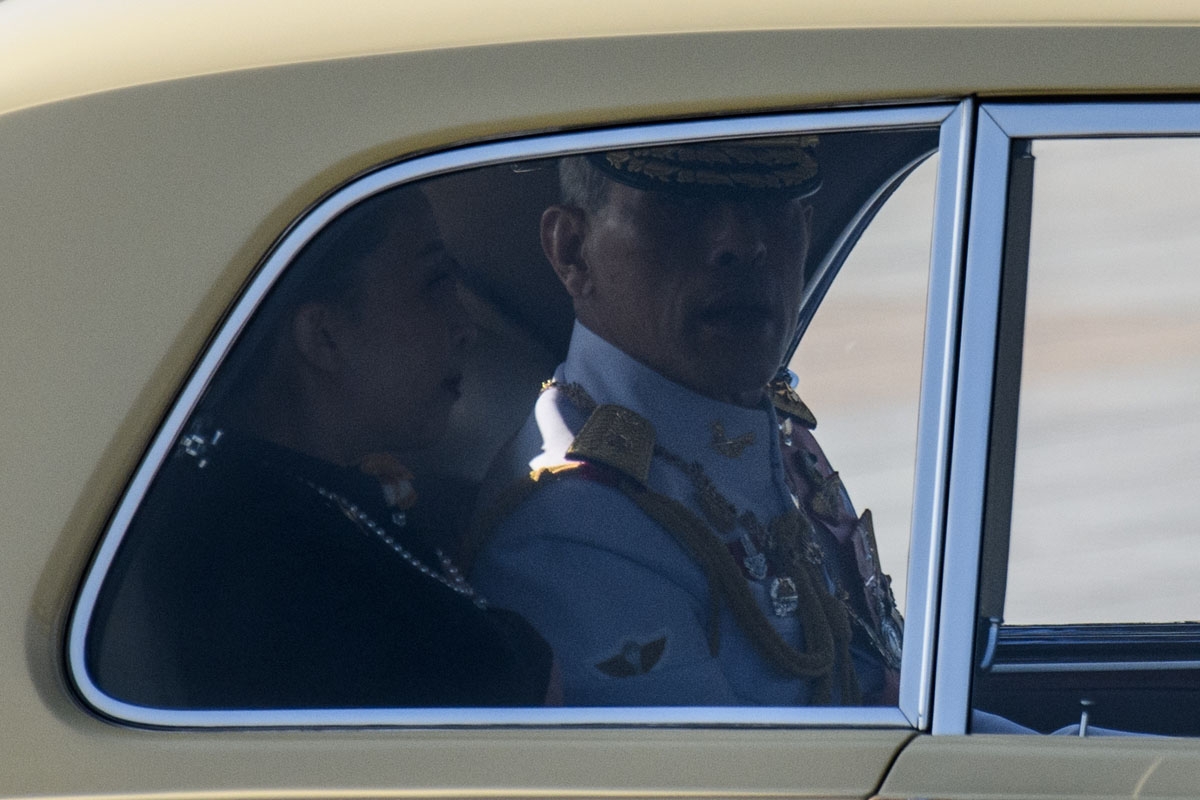 Thai King Maha Vajiralongkorn (R) arrives with his daughter Princess Bajarakitiyabha, the morning after the late Thai king Bhumibol Adulyadej was cremated at the Royal Crematorium of the Grand Palace in Bangkok on October 27, 2017.