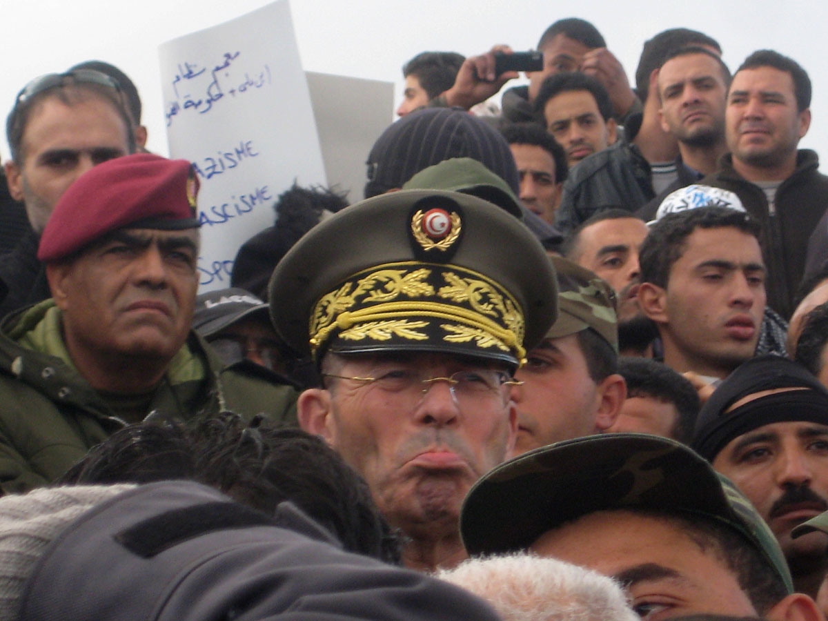 Tunisian army Chief of Staff, General Rachid Ammar (C), addresses the crowd in central Tunis on January 24, 2011. Tunisia's army chief warned that a power vacuum in the country could lead to dictatorship, as the government prepared a major cabinet reshuf
