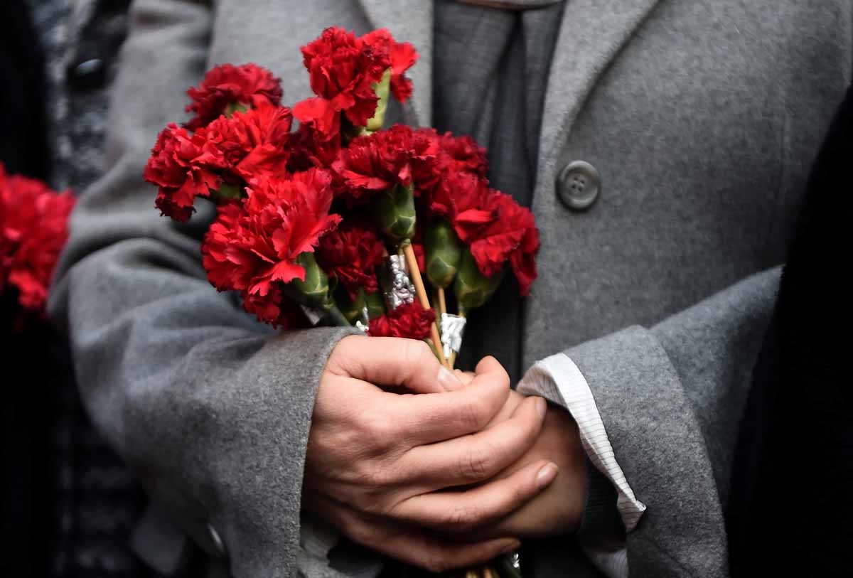 A woman holds flowers in front of the Reina night club, on January 2, 2017 in Istanbul, one day after a gunman killed 39 people, including many foreigners, in a rampage at an upmarket nightclub in Istanbul where revellers were celebrating the New Year. A woman holds flowers in front of the Reina night club, on January 2, 2017 in Istanbul, one day after a gunman killed 39 people, including many foreigners, in a rampage at an upmarket nightclub in Istanbul where revellers were celebrating the New Year.