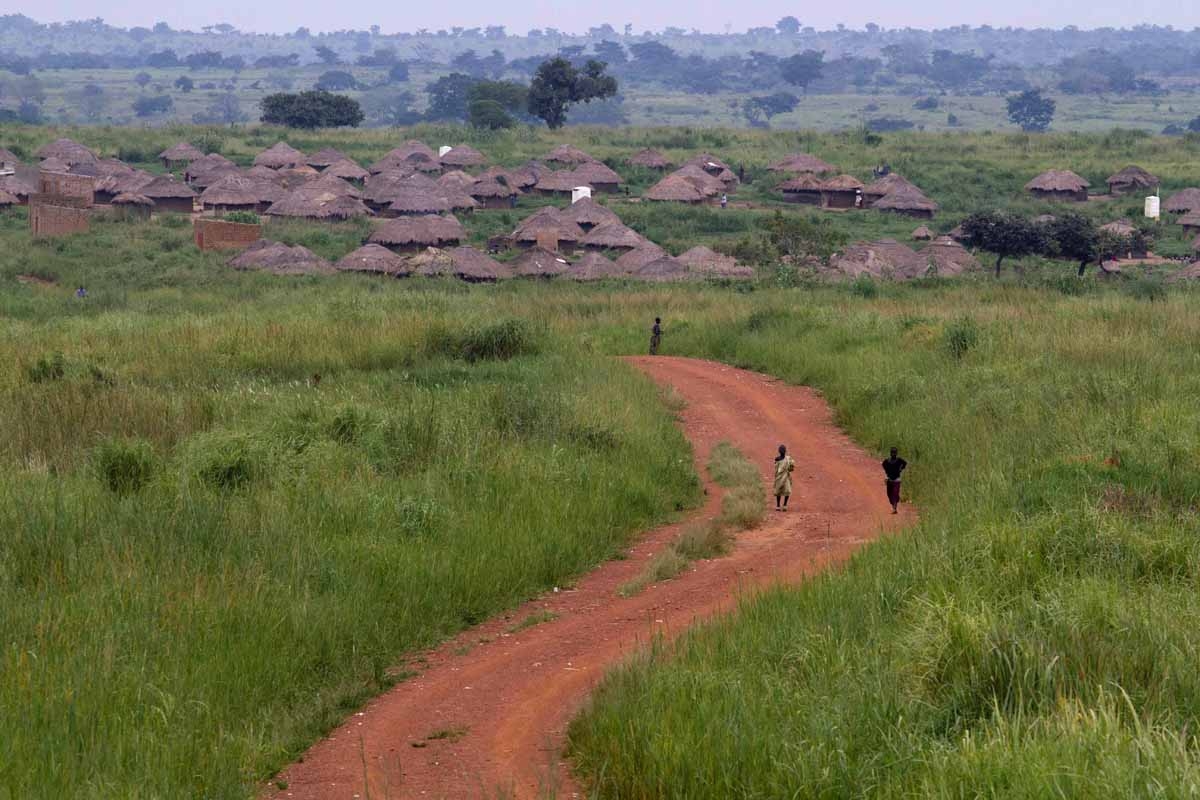 Children walk on a road leading to the northern Ugandan village of Amuru on August 26, 2010. Children walk on a road leading to the northern Ugandan village of Amuru on August 26, 2010.