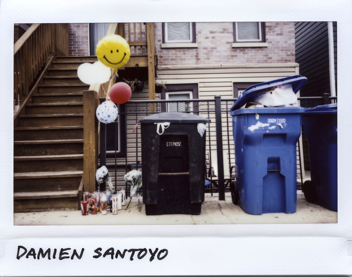 A vigil for Damien Santoyo, 14-year-old, who died on August 6, 2017 on the steps after being shot in the head during a drive-by shooting in the 1700 block of South Newberry Avenue in Chicago, Illinois on August 7, 2017.