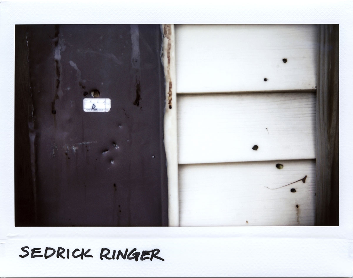 Bullet holes are seen around the front porch where Sedrick Ringer, 50-year-old, was killed in the 5700 block of South Wells Street in Chicago, Illinois on July 3, 2017. Ringer was shot 9 times and died at the scene June 30, 2017.