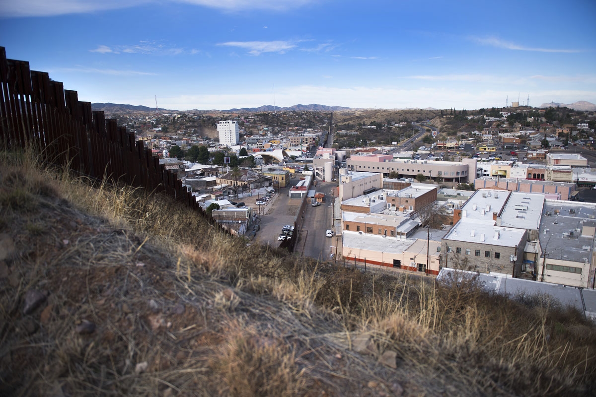 The border fence stretching through Nogales, Arizona, and Nogales, Mexico, is seen on February 17, 2017, on the US/Mexico border.