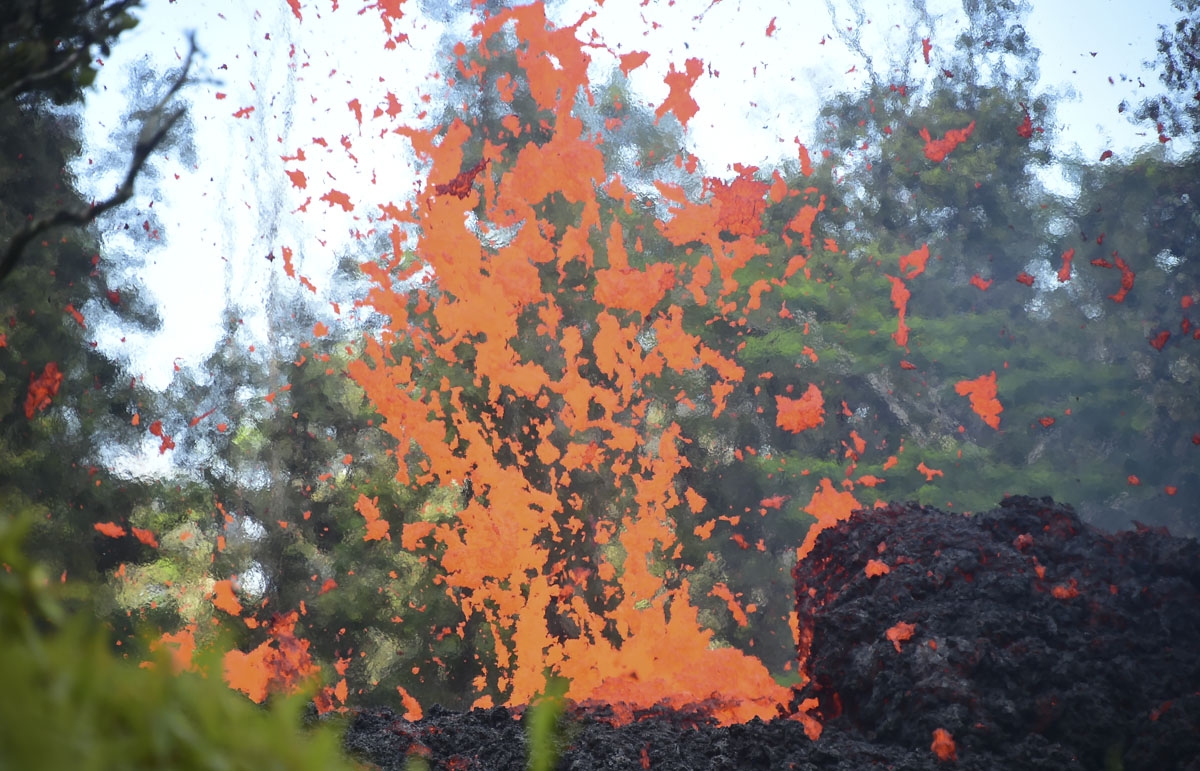 Lava is seen coming from a fissure in Leilani Estates subdivision on Hawaii's Big Island on May 4, 2018.