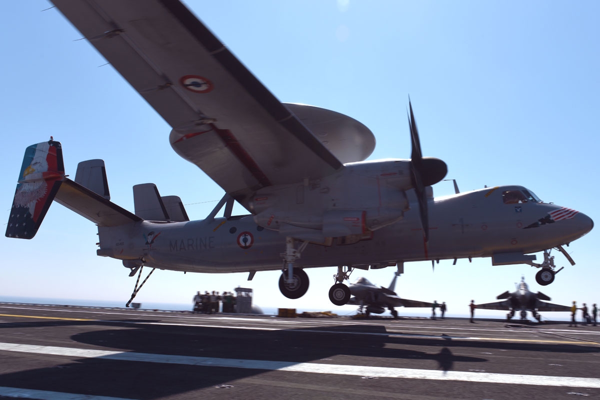 A French Hawkeye surveillance plane traps as it lands on the USS George H.W. Bush aircraft carrier on May 11, 2018 in the Atlantic Ocean.
