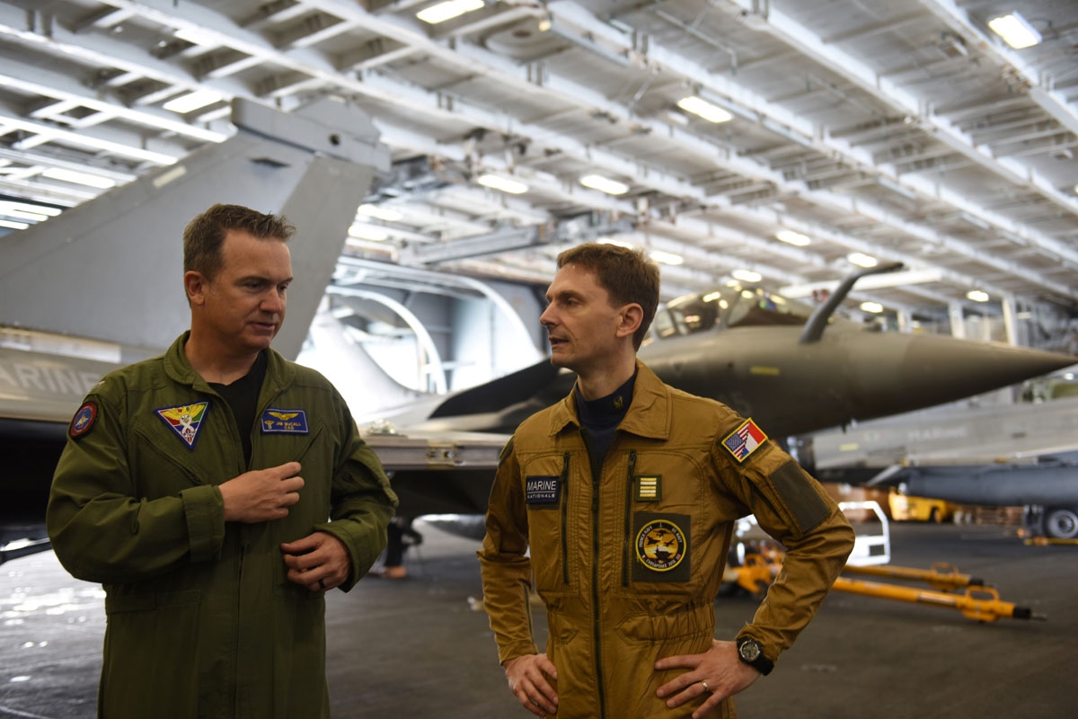 commander of the carrier Air wing, commander Marc (R), and Jim Mc Call, his US Navy counterpart on the USS George H.W. Bush aircraft carrier answer journalists questions on May 12, 2018 in the Atlantic Ocean.