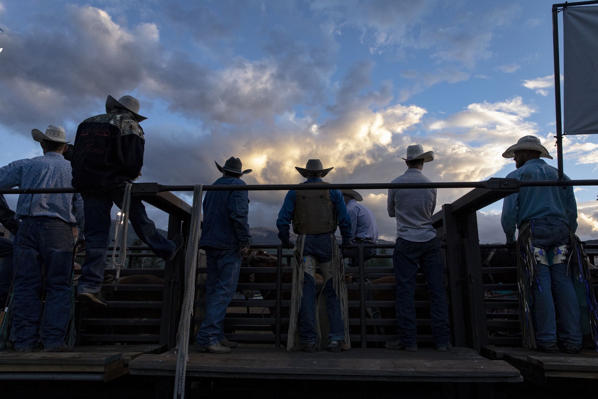 Cowboys watch the rodeo from behind the chute at the Snowmass Rodeo on August 22, 2018, in Snowmass, Colorado. The Snowmass rodeo is on its 45th year, making it one of the longest running rodeos in Colorado.
