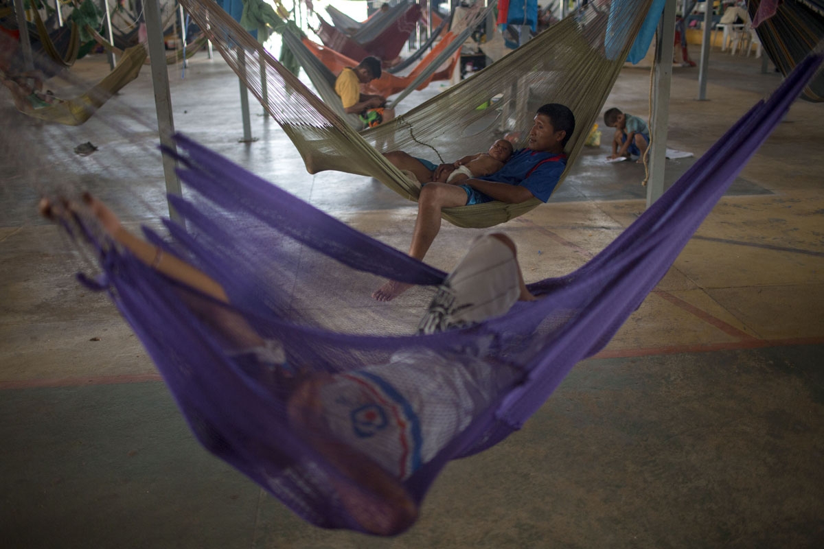 Venezuelan indigenous refugees rest on their hammocks, at the Pintolandia shelter in the city of Boa Vista, Roraima, Brazil, on February 24, 2018.