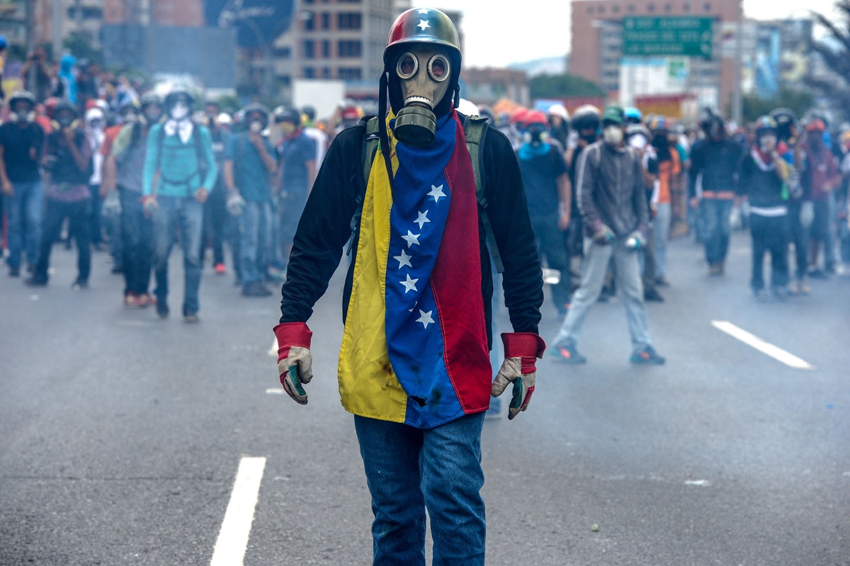pposition activists protest against President Nicolas Maduro, in Caracas on May 8, 2017.