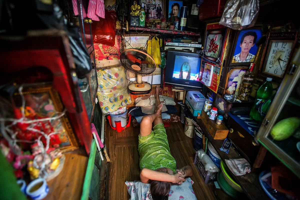 Kha Tu Ngoc rests in her two-square-meter house in Ho Chi Minh City on May 2, 2018.