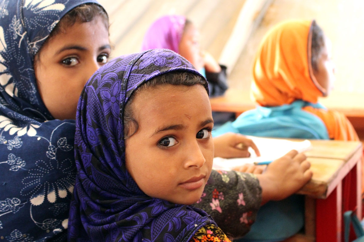 Displaced Yemeni children, who fled due to the fighting between the Saudi-led coalition and Houthi rebels, study inside a tent at a camp in the northern district of Abs in Yemen's Hajjah province, on February 24, 2018.
