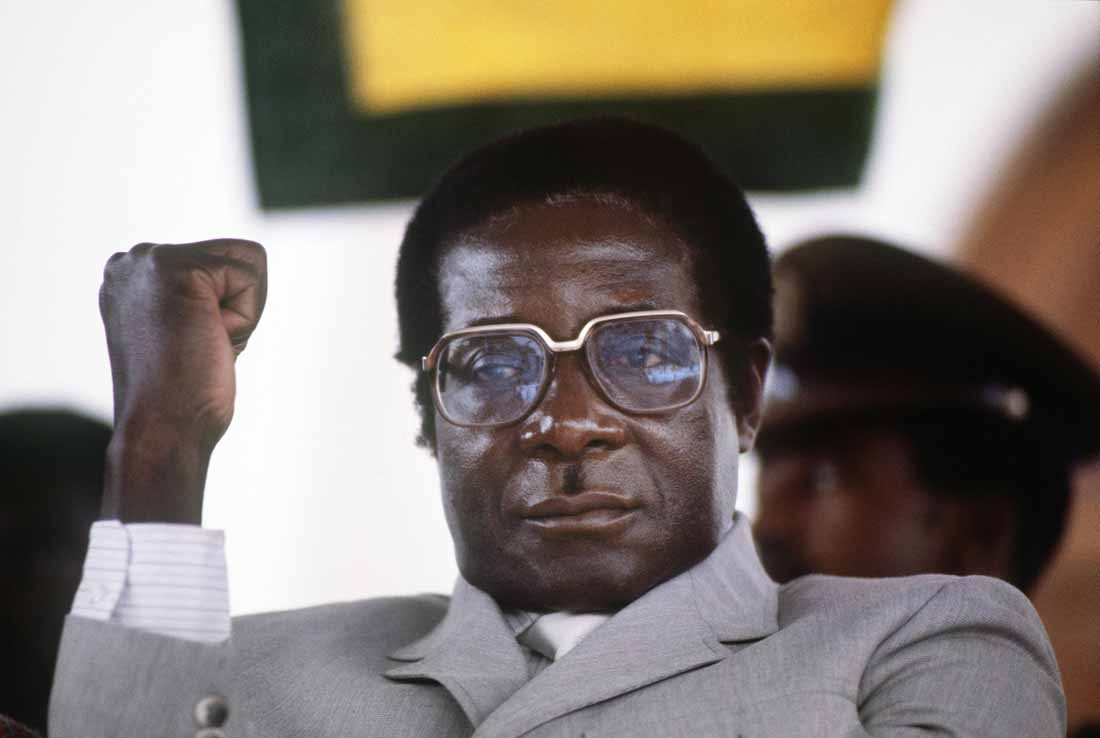 Robert Mugabe, then prime minister, gestures at a Harare stadium during a meeting on July 1, 1984.