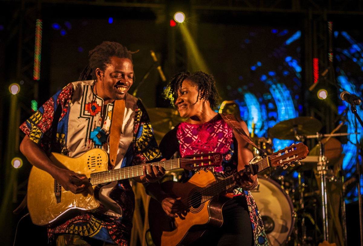Cameroonian artist Kareyce Fotso (R) performs with her band at the Harare International Festival of the Arts (HIFA) in Zimbabwe on May 4, 2017.