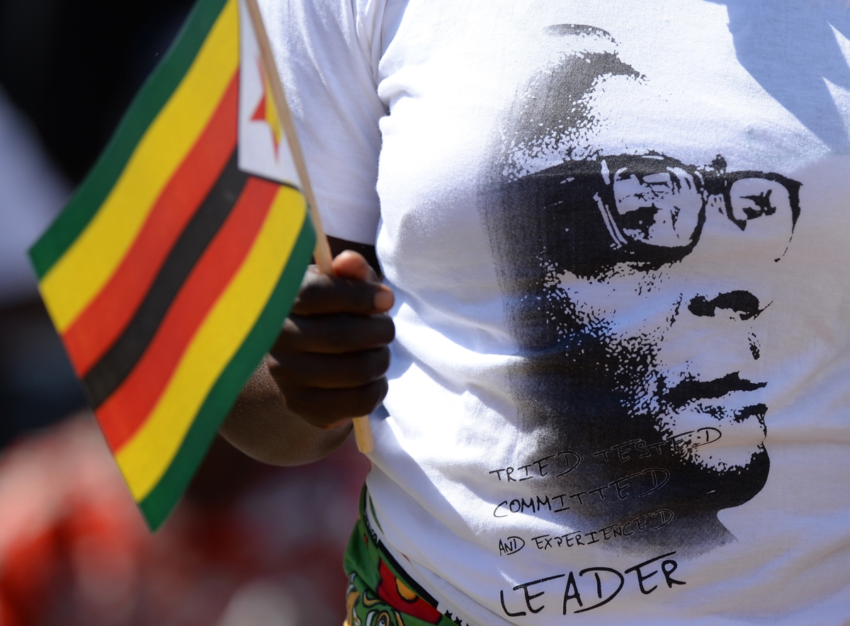 And another -- a supporter of President Robert Mugabe during his swearing-in ceremony on August 22, 2013 in Harare.