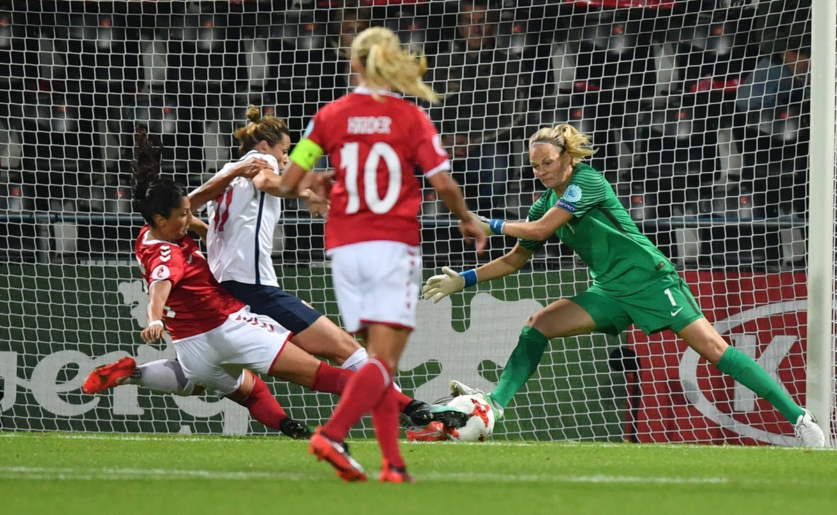 Norway's goalkeeper Ingrid Hjelmseth (R) vies with Denmark's Nadia Nadim (L) during the UEFA Women's Euro 2017 football tournament match between Norway and Denmark at Stadion De Adelaarshorst in Deventer city on July 24, 2017.