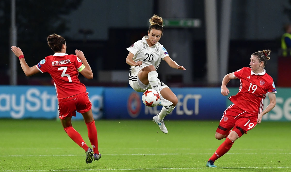 Germany's midfielder Lina Magull (C) vies with Russia's defender Anna Kozhnikova (L) and Russia's defender Ekaterina Morozova during the UEFA Women's Euro 2017 football match between Russia and Germany at Galgenwaard Stadium in Utrecht on July 25, 2017.