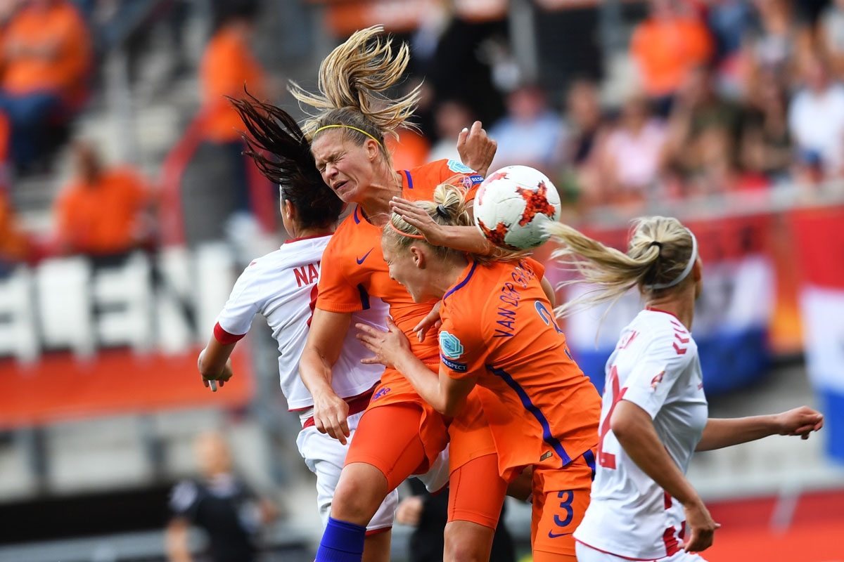 Nadia Nadim (L) vies for the ball with Netherlands' defender Stephanie van der Gragt (2nd R) during the UEFA Womenâs Euro 2017 football tournament final match between Netherlands and Denmark at Fc Twente Stadium in Enschede on August 6, 2017
